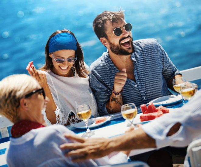 A couple eating food on a cruise ship.