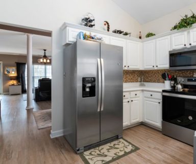 A stainless steel fridge in a modern kitchen.